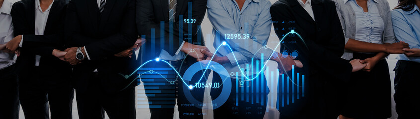A diverse group of professionals stands together in a corporate setting, showcasing teamwork and collaboration, with dynamic financial graphs illustrating growth and analysis. Scalp © InfiniteFlow