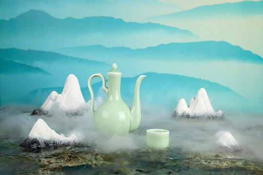 Serene celadon teapot and cup in misty zen mountain still life
