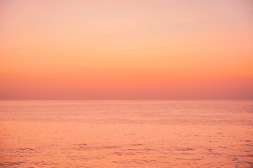 Fototapeta premium Tranquil Orange Sunset Over Calm Sea