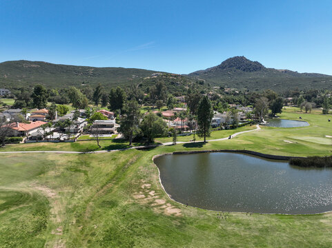 Aerial view of Ramona neighborhood with mountain, valley and San Vicente Golf Course, in California, USA