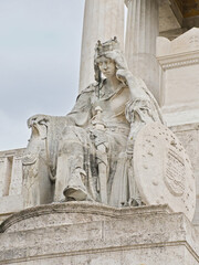 Fototapeta premium Statue of a person with shield and sword, sitting in Kerepesi, historical graveyard along Fiume Road in Budapest, 