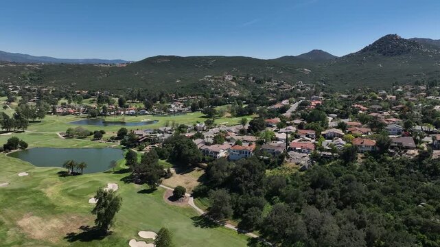 Aerial view of Ramona neighborhood with mountain, valley and San Vicente Golf Course, in California, USA