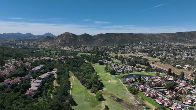 Aerial view of Ramona neighborhood with mountain, valley and San Vicente Golf Course, in California, USA