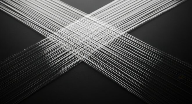 Abstract white brush strokes forming an x shape on a dark textured surface