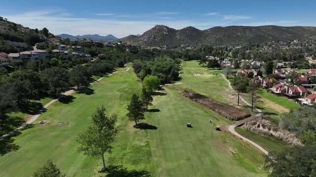 Aerial view of Ramona neighborhood with mountain, valley and San Vicente Golf Course, in California, USA