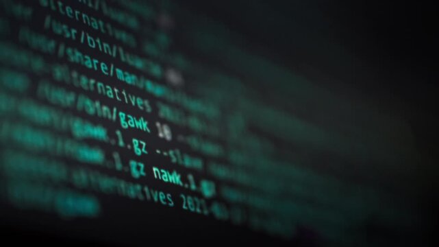 On the monitor screen, a mesmerizing reflection of lines of code and symbols flashes rapidly, illustrating the dynamic interface of artificial intelligence at work