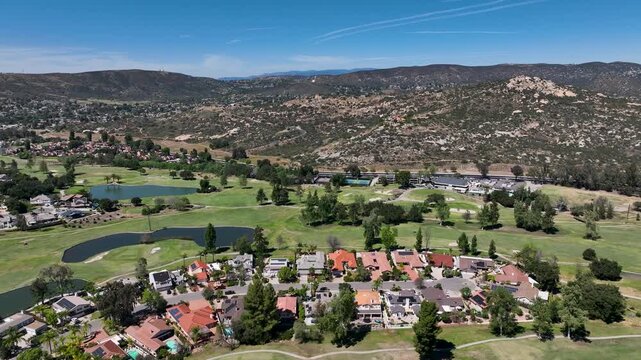 Aerial view of Ramona neighborhood with mountain, valley and San Vicente Golf Course, in California, USA