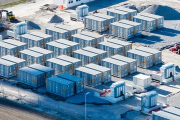 Aerial view on battery energy storage system for renewable power plant. Industrial lithium batteries facility for clean electricity grid management and sustainable technology infrastructure. © biletskiyevgeniy