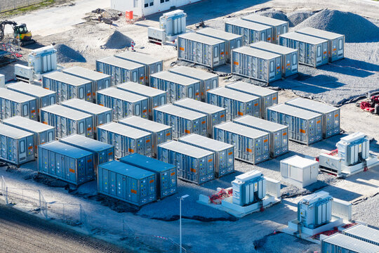 Aerial view on battery energy storage system for renewable power plant. Industrial lithium batteries facility for clean electricity grid management and sustainable technology infrastructure.
