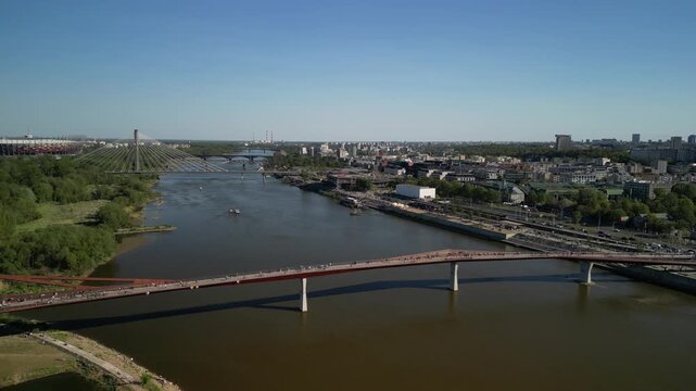 Kielce - Polska - zach&oacute;d słońca nad miastem nagrany dronem. Ujęcie kinowe z powietrza, piękne kolory, budynki, ulice, samochody w ruchu