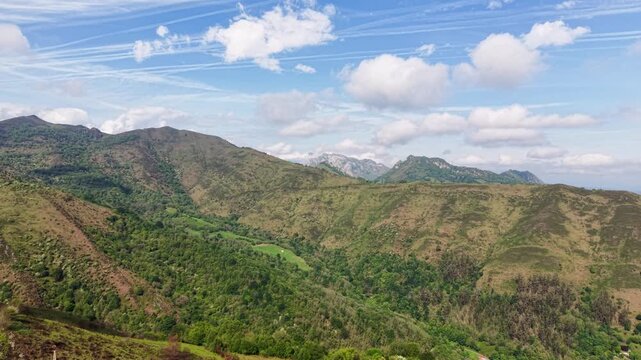 Aerial panorama of rural Asturias nature with mountain peaks and forests of Northen Spain