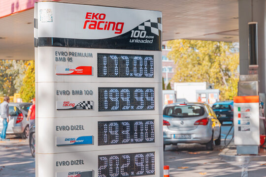 25 October 2025, Belgrade, Serbia: EKO Racing fuel price display board showing petrol and diesel prices at a gas station with vehicles refueling