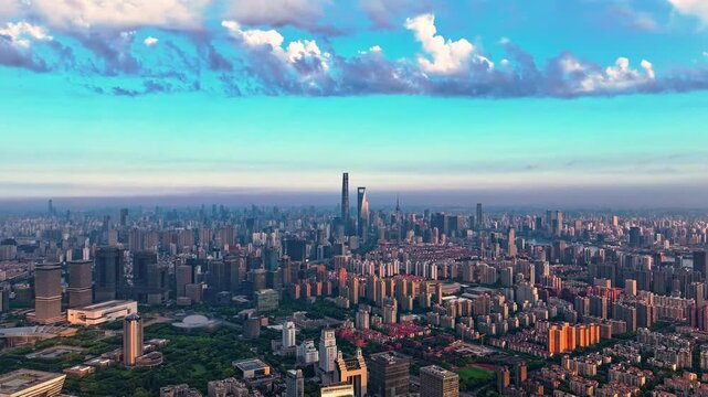 Aerial panoramic Shanghai skyline at sunset with modern skyscrapers and dramatic clouds