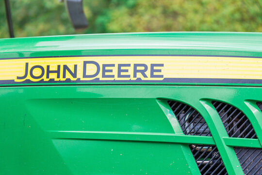 12 October 2025, Valjevo, Serbia: John Deere logo on the green hood of an agricultural tractor, representing farming, industry, and modern machinery