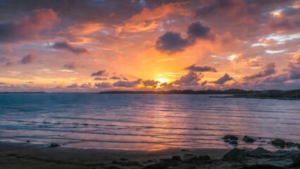 Fototapeta premium Golden sun dips behind distant horizon