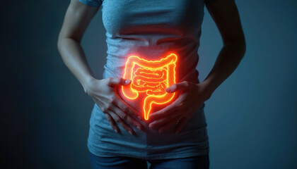 Fototapeta na wymiar Woman holds stomach showing glowing intestines. Concept of digestive system pain, colitis, IBS, and colon issues. Health awareness for abdominal discomfort.