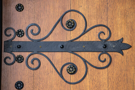 Ornate iron hinge on a wooden door at the Saint Nedelya Cathedral in Sofia.
