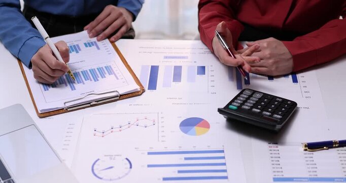 Analyze financial data and accounting record with calculator in meeting office, Accounting company charts and graphs banner, double exposure successful business finance and taxation planning concept.