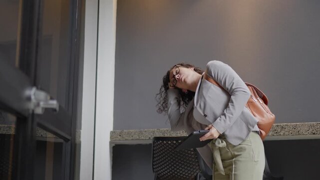 Stressed business professional feeling dizzy outside office
