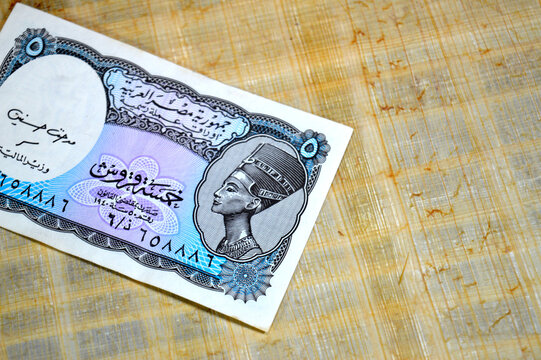 The obverse side of a vintage Egyptian 5 Piastres banknote featuring a portrait of Queen Nefertiti, part of the Egyptian Pound, old vintage retro money