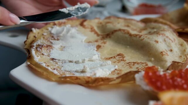 Traditional blini with cream cheese and red caviar. Maslenitsa. High quality 4k footage