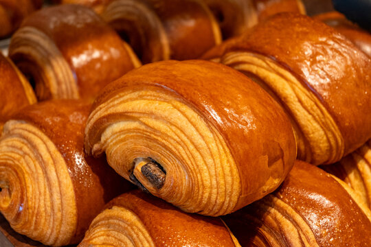 French pastry roll pain au chocolat for traditional breakfast, fresh baked in artinasal bakery in Paris, France