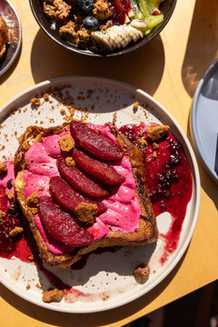 rhubarb french toast with berry compote at brunch restaurant