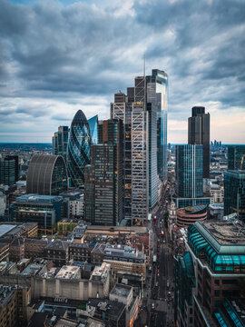 Panoramic aerial view of the illuminated City of London skyline with office skyscrapers and street traffic at Bishopsgate and Liverpool Street