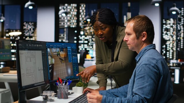 Diverse engineers team creates 3D render of apartment interior with architectural software and blueprints. Using computer with modern tools and models to allow customization of flooring. Camera B.