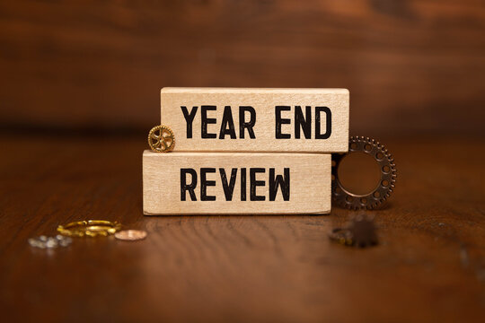 Red notebook with handwritten text note YEAR-END REFLECTION