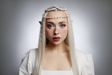 Naklejka premium Beautiful elf girl on grey gradient background