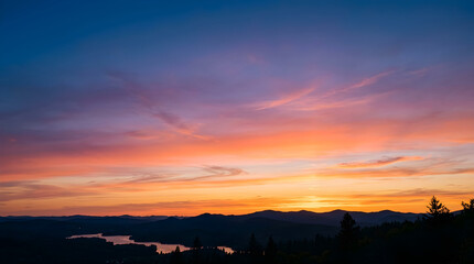 Fototapeta premium Sunset over mountains and lake