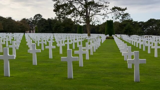Rows of white crosses at the American World War II cemetery on the Normandy coast, Colleville-sur-Mer, Manche department, France, October 16, 2025. High quality 4k footage. 
