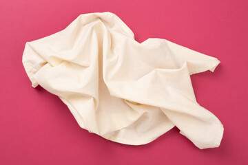 Fototapeta premium Kitchen napkin on color background, top view