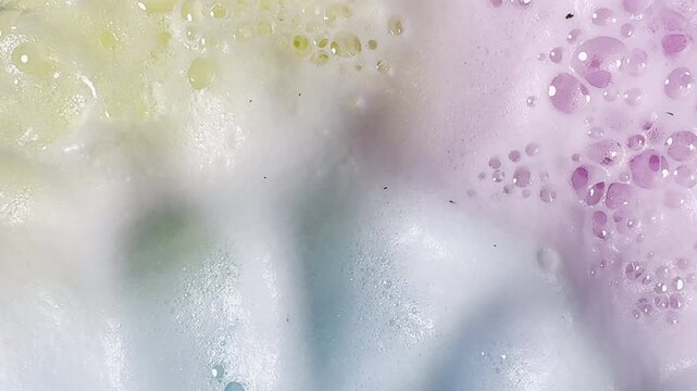 Bath bombs produce fizz and bubbles in undulating graphic element