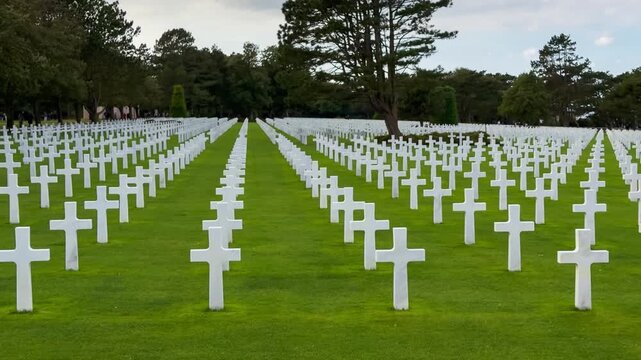 Rows of white crosses at the American World War II cemetery on the Normandy coast, Colleville-sur-Mer, Manche department, France, October 16, 2025. High quality 4k footage. 