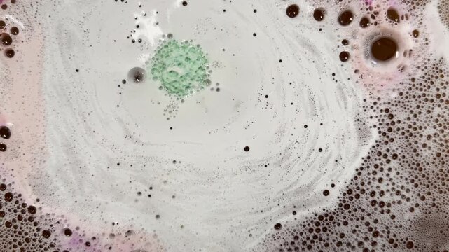 Fizzing bath bomb creates surreal nebula graphic element