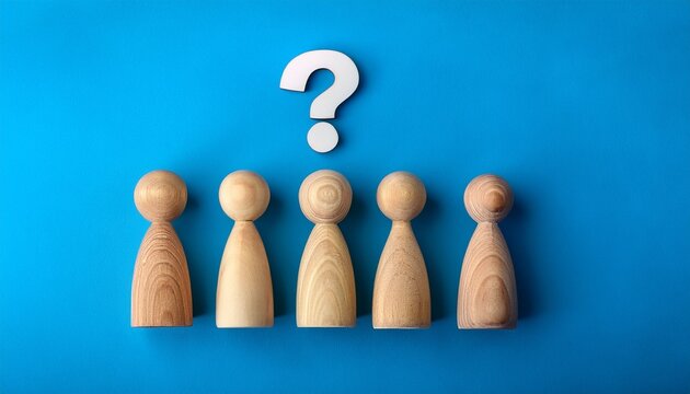 five wooden figurines with a question mark above the middle one on blue background