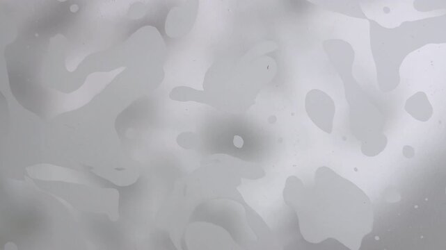 Soapy foam floating in bathtub creates abstract background plate