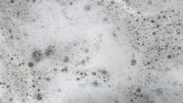 Soapy bubbles jiggle and gyrate to create graphic background element