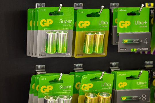 Close-up of GP Super and Ultra alkaline C size batteries in blister packs on a store shelf. High-performance power cells for heavy duty household devices. Astana, Kazakhstan - April 18, 2024