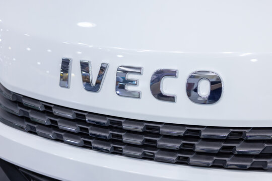 Chrome IVECO logo emblem on a white commercial truck radiator grille. Close up of automotive branding and industrial vehicle design details. Astana, Kazakhstan - May 30, 2024
