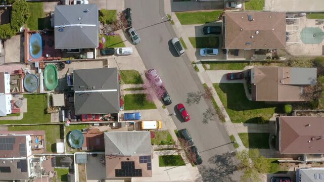 daytime overhead aerial street view of residential neighborhood in New York State, USA