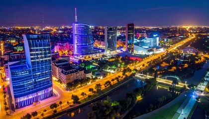 Naklejka premium modern cityscape at night with illuminated skyscrapers, bustling streets, and a winding river, showcasing urban development and vibrant nightlife
