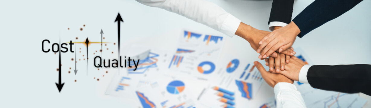 A close-up view of multiple hands joined together, symbolizing teamwork and collaboration in a business context focused on cost and quality analysis for strategic growth. Trope