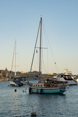 Fototapeta premium Luxury yachts and sailing boats moored in the historic yacht marina of Valletta Grand Harbour Malta 