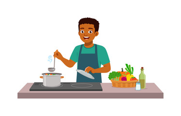 Happy African American man cooking soup in kitchen with fresh vegetables smiling