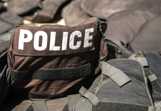 Old bulletproof vests and riot police helmets.