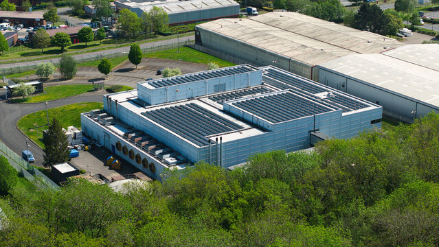 Aerial view of the Data Centre facility featuring rooftop solar panels and industrial cooling systems in Wellingborough, England, United Kingdom.