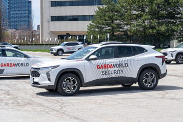 Fototapeta premium Toronto, Canada - April 26, 2026: GardaWorld vehicles parked outside its office in Toronto, Canada. GardaWorld Corporation is a Canadian private security firm.